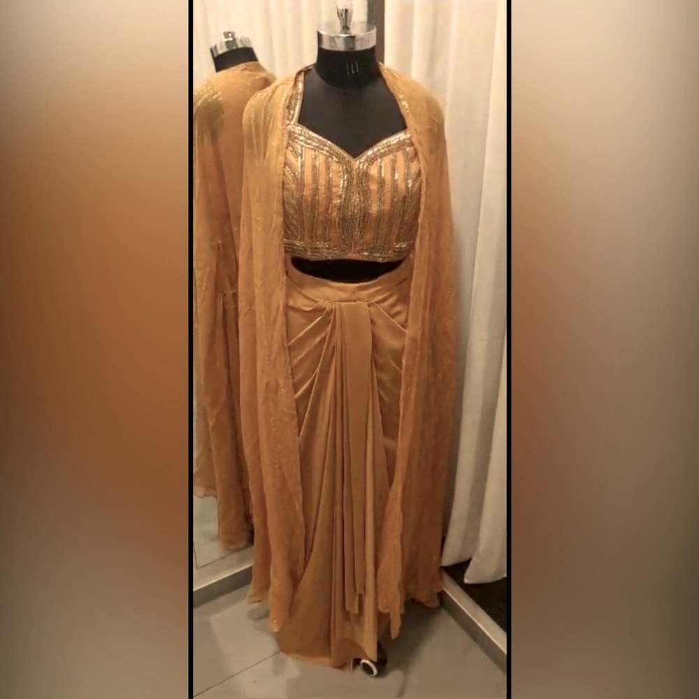 Very stylish and trendy with very beautiful Gold Embellished dhoti shrug dress